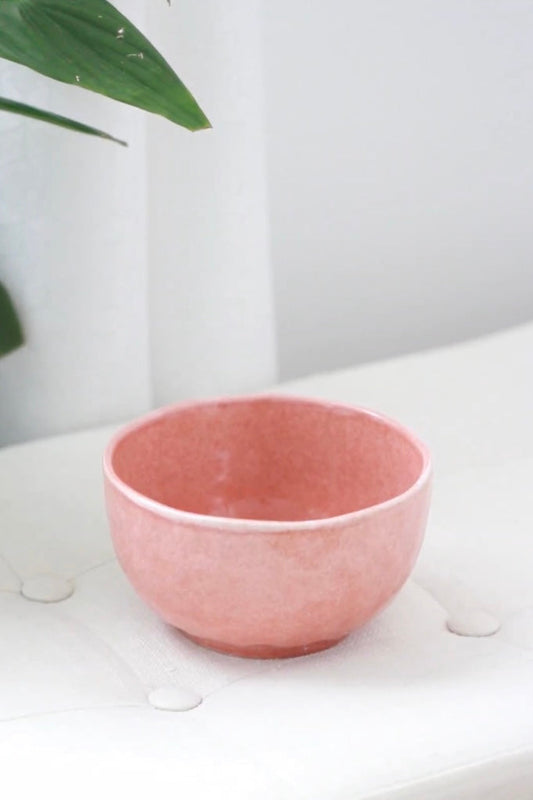 Coral ceramic matcha bowl with a soft speckled finish, designed for traditional matcha preparation and serving.