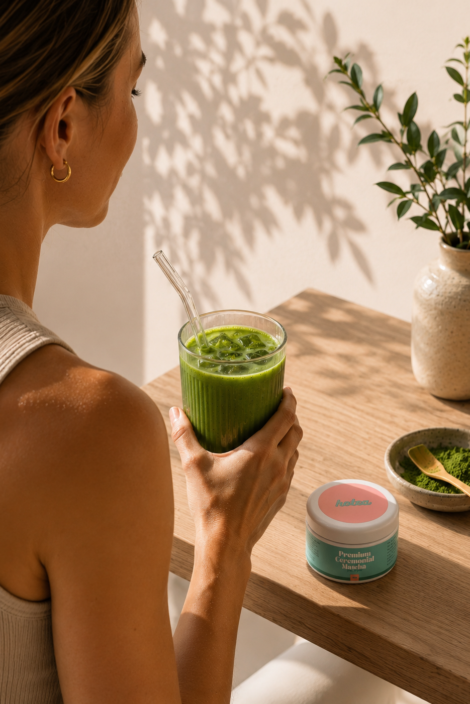 Woman enjoying premium ceremonial matcha as part of a daily wellness ritual. Hotea. Matcha. Woman drinking premium ceremonial matcha for natural energy, focus and wellbeing